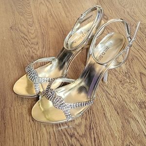 Wild Diva gold heels in a size 8 with rhinestone details.